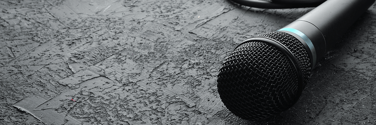 Microphone on black stone table. Studio. Top view. Free space for text. Copy space.